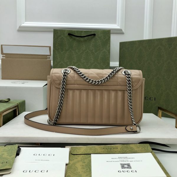 On this small shoulder bag, classic materials are combined with vertical and herringbone patterns to create a distinctive geometric style design. - Image 8