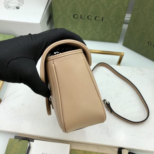 On this small shoulder bag, classic materials are combined with vertical and herringbone patterns to create a distinctive geometric style design. - Image 7