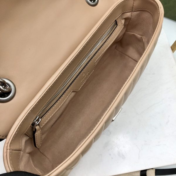 On this small shoulder bag, classic materials are combined with vertical and herringbone patterns to create a distinctive geometric style design. - Image 2